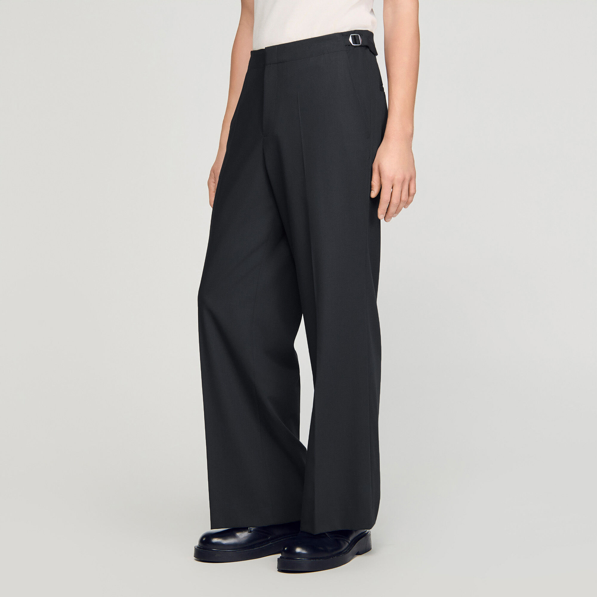 Pantaloni larghi in lana con fibbie