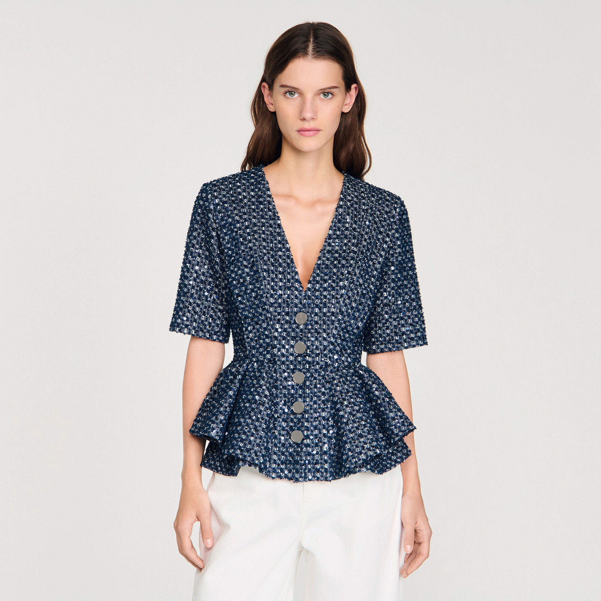 Top con applicazioni di paillettes