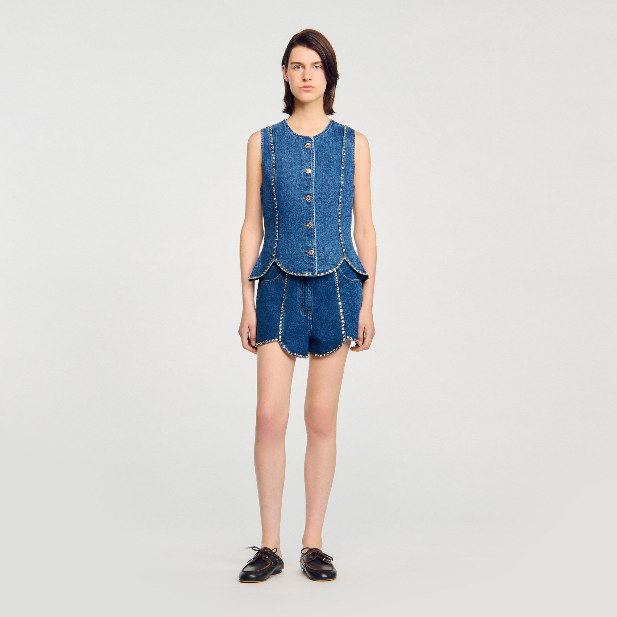 Top in denim con strass