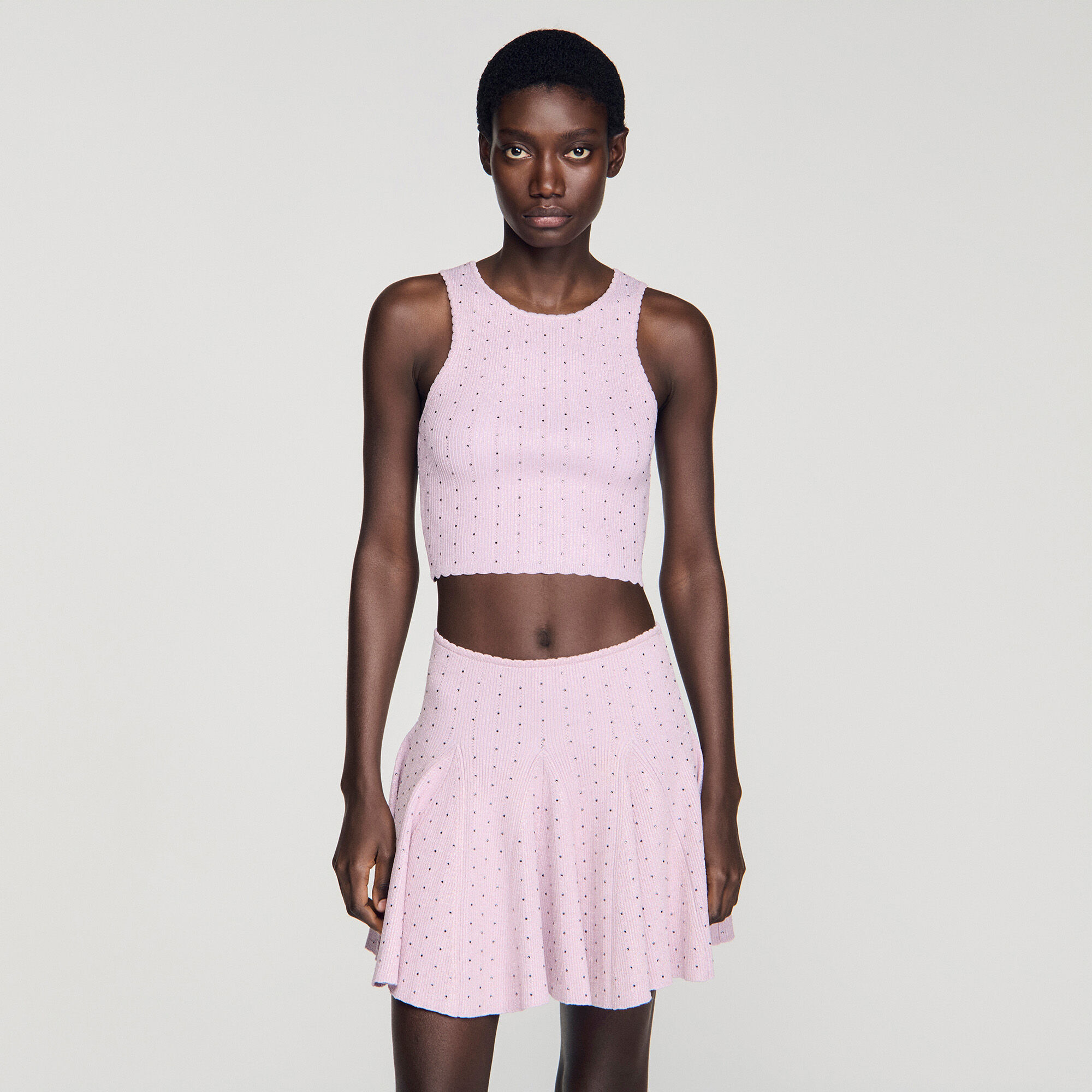 Top corto in maglia con strass