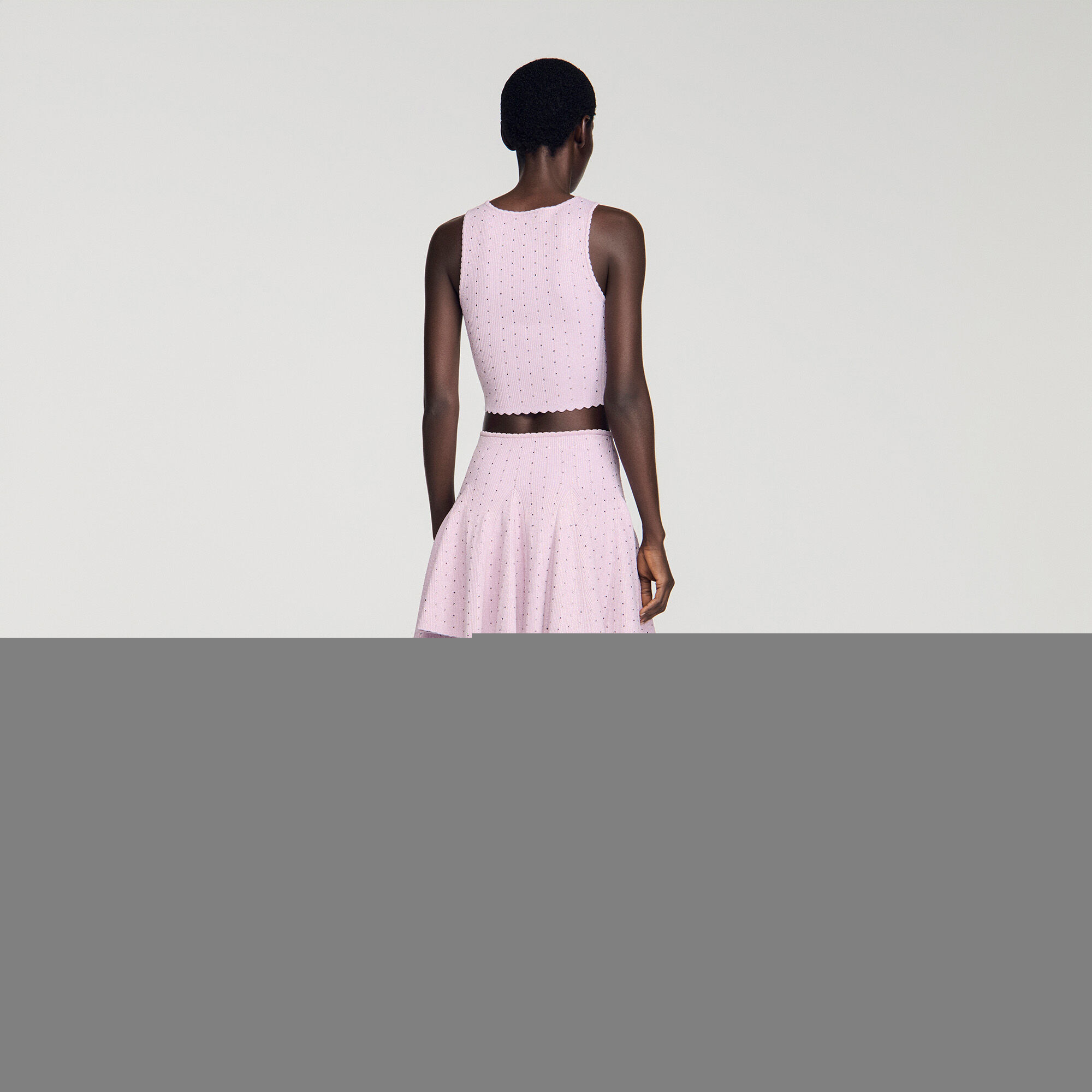 Top corto in maglia con strass