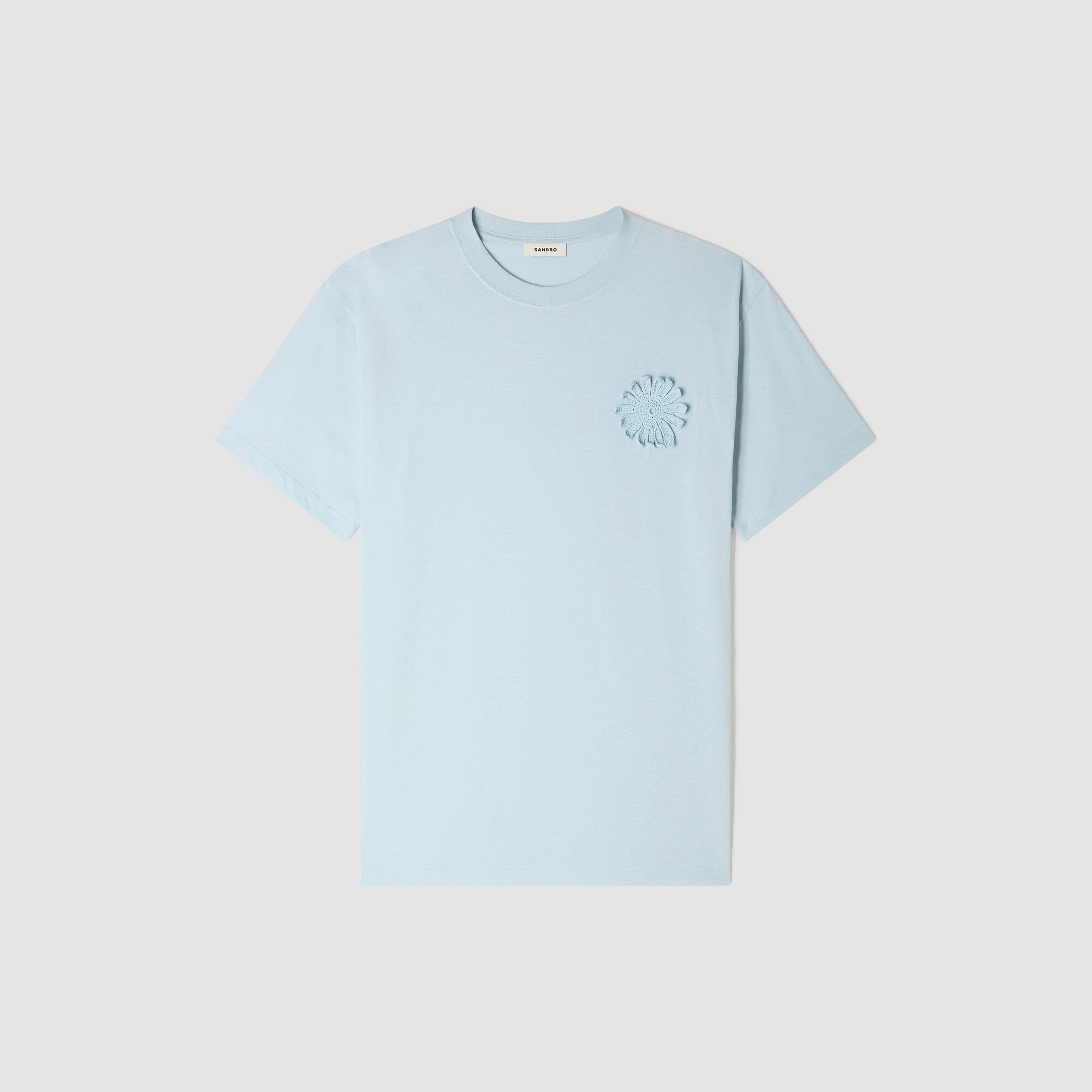 T-shirt in cotone con fiore all'uncinetto