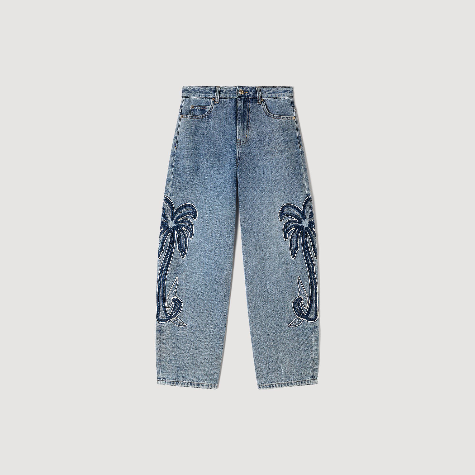 Jeans a gamba larga con ricamo palma