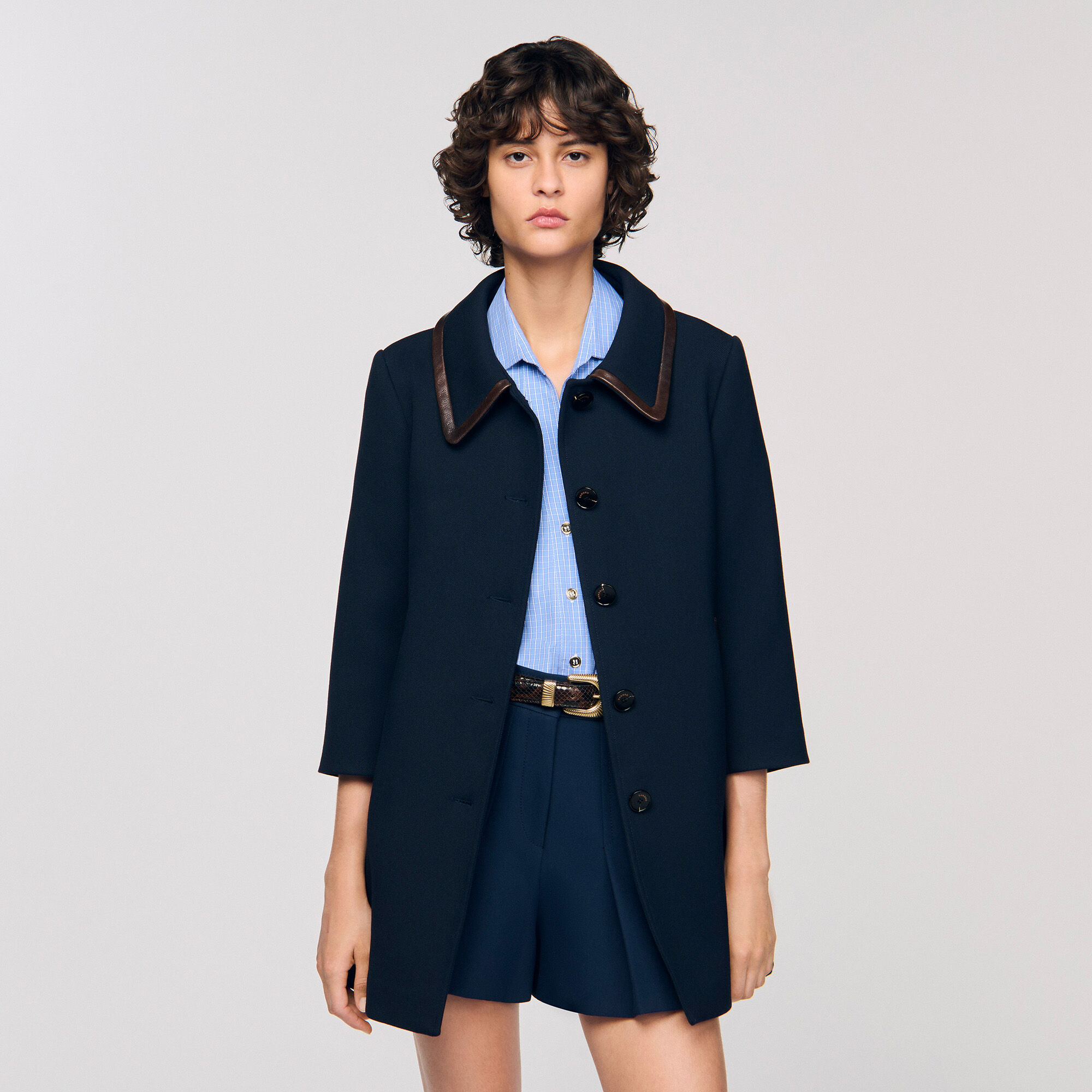 Cappotto con rifiniture in pelle