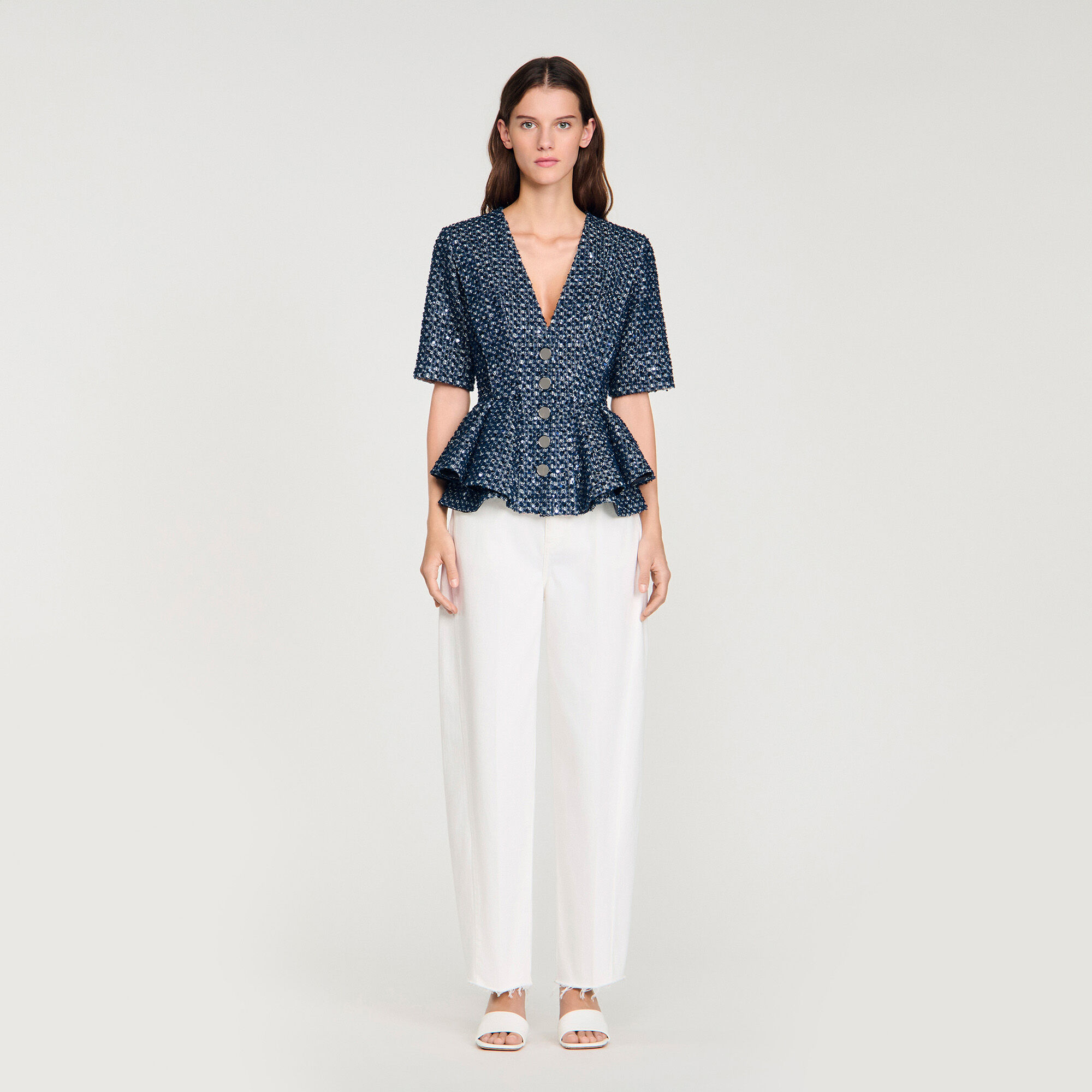 Top con applicazioni di paillettes