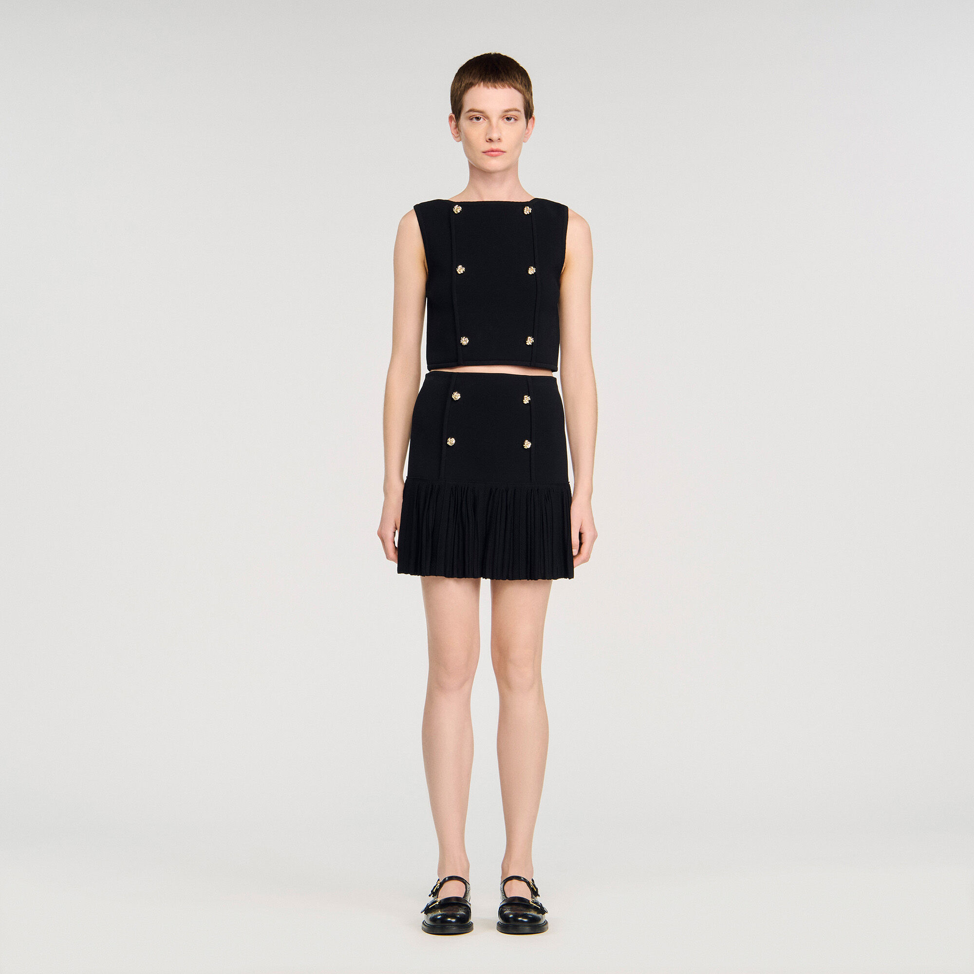 Mini gonna in maglia fine a pieghe