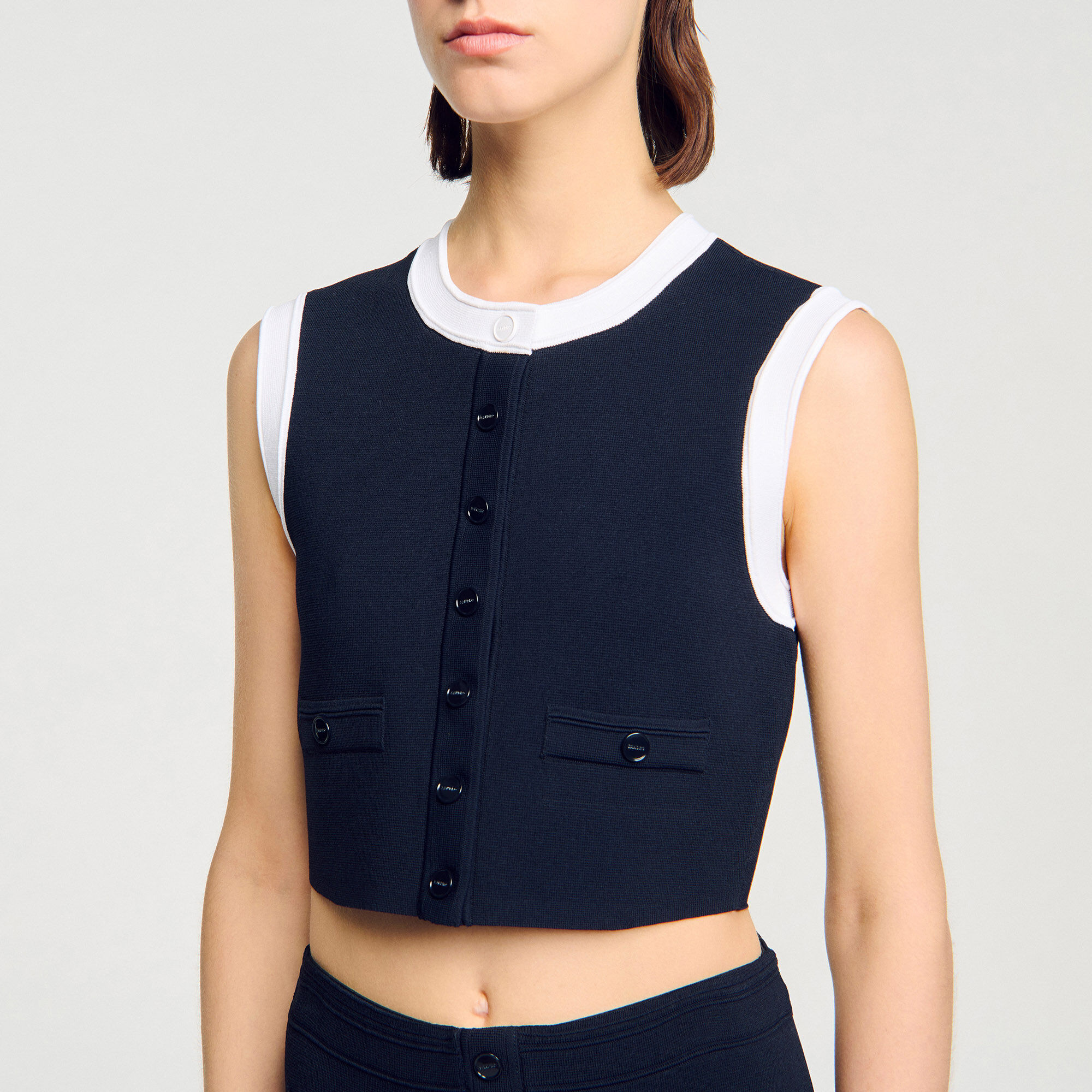 Top corto in maglia a due toni
